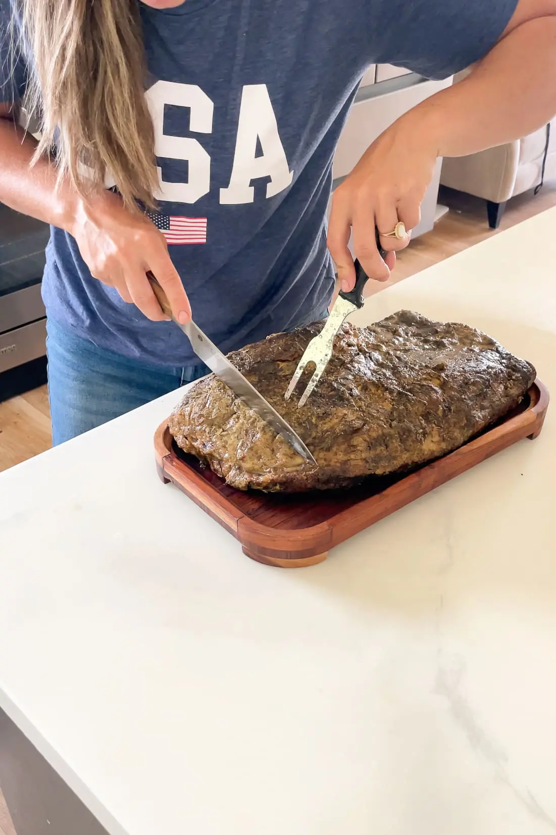 Slicing smoked brisket.
